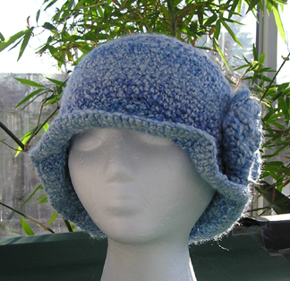 cloche style crochet hat with flower